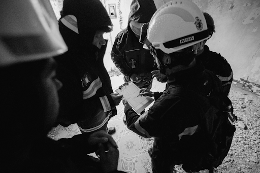 An industrial safety supervisor and facility worker conducting a compliance walkthrough in a manufacturing environment, representing the employee interview and on-site review process OSHA inspectors use during Hazard Communication Standard audits under CPL 02-02-079.