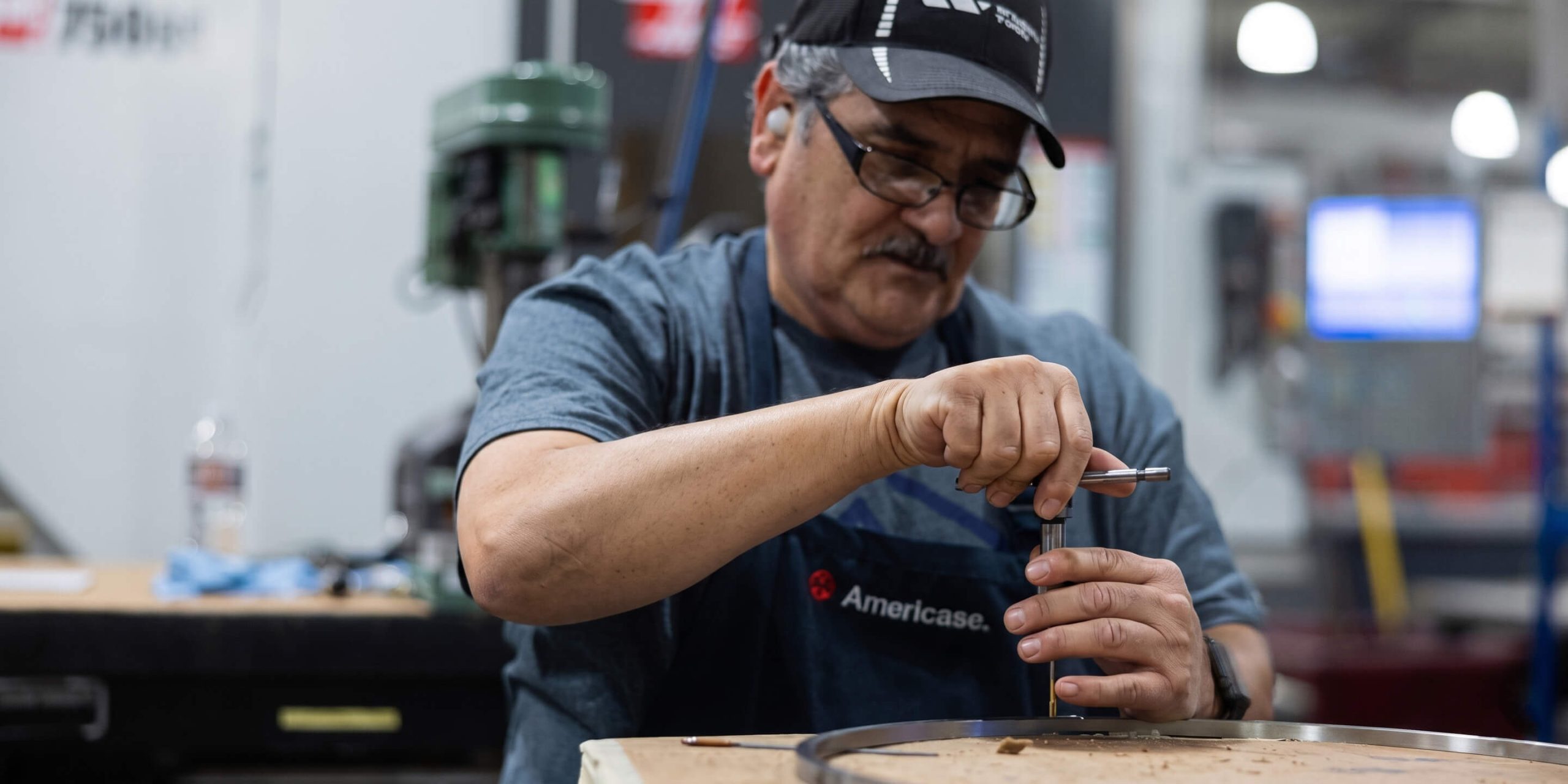 Americase Worker Assembling an Americase Package